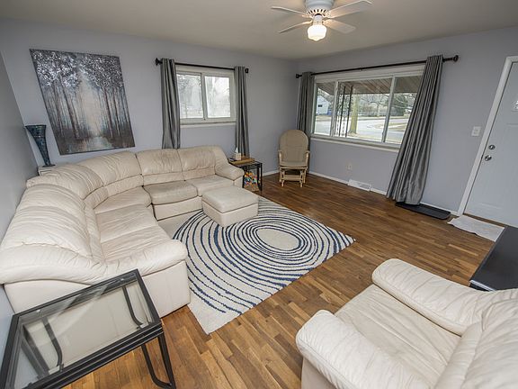 The front door opens onto the large living room (15x15) with original wood floors and and a bank of windows overlooking the front porch and yard.