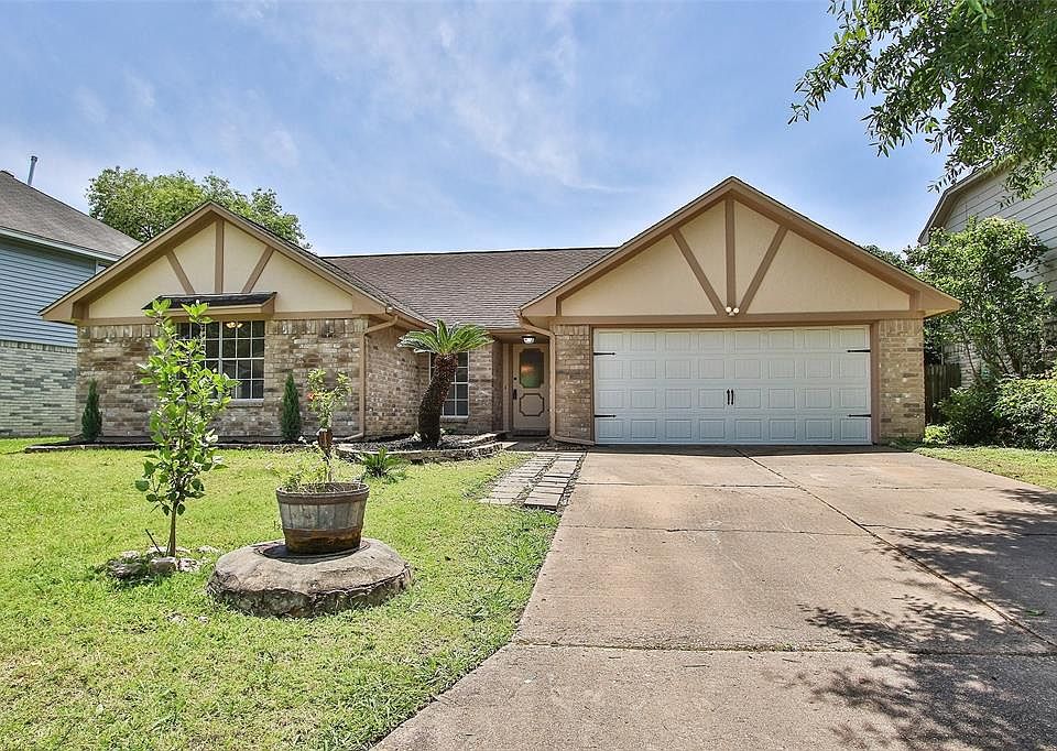 Welcome home to 17007 Spruce Run Drive located on a quiet street in Colony Creek Village! This lovely home has lovely curb appeal, a well-manicured lawn, beautiful landscaping, brick elevation, beautiful front door, and a double wide driveway!
