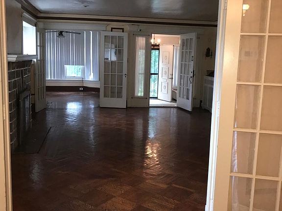 Angle View of Front Entrance, Livingroom And Enclosed Porch or Office Space