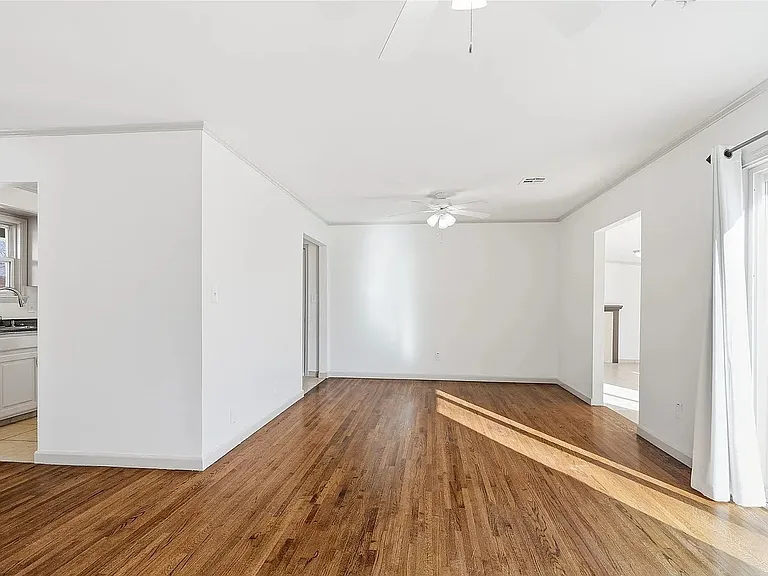 Open living and dining space with plenty of room to relax and entertain, featuring abundant natural light and sliding glass doors that lead to a private patio_perfect for outdoor dining, entertaining, or enjoying your morning coffee.