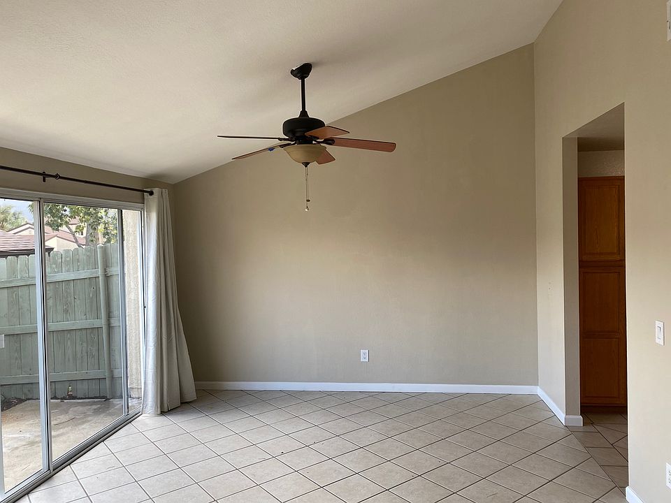 Family room which opens to back patio area and offers a fireplace.