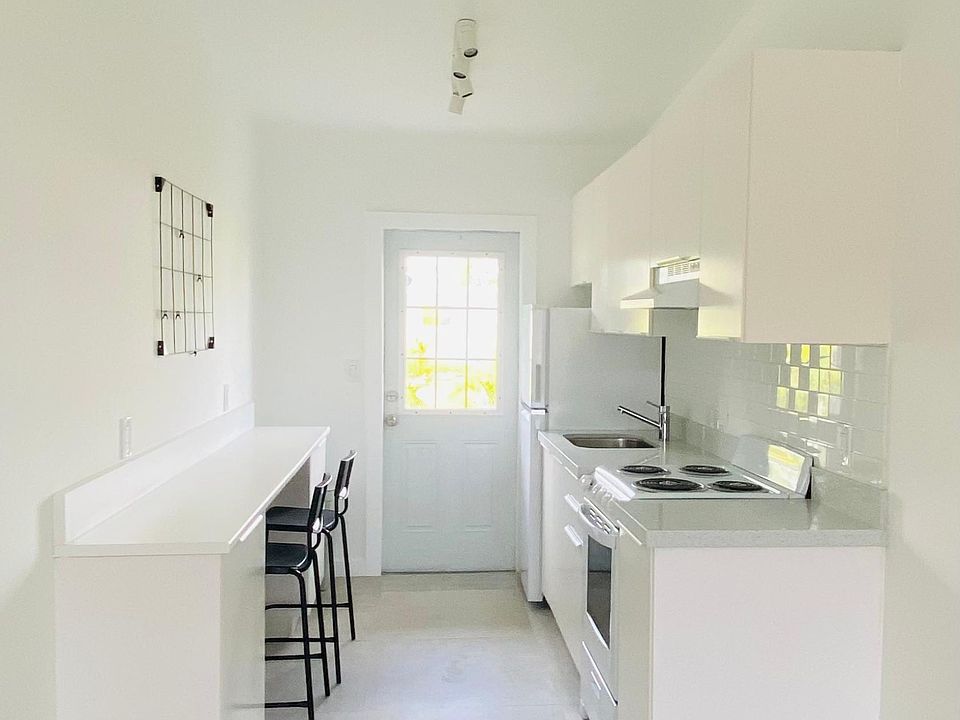 The social area consists of a living room, a dining space and an amazing kitchen with a preparation side and either a breakfast or a home office space.