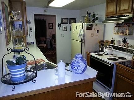 Kitchen looking into living room
