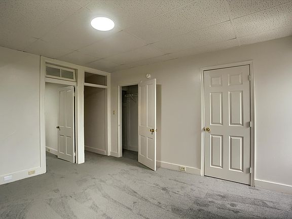 Enter primary bedroom or hall to kitchen