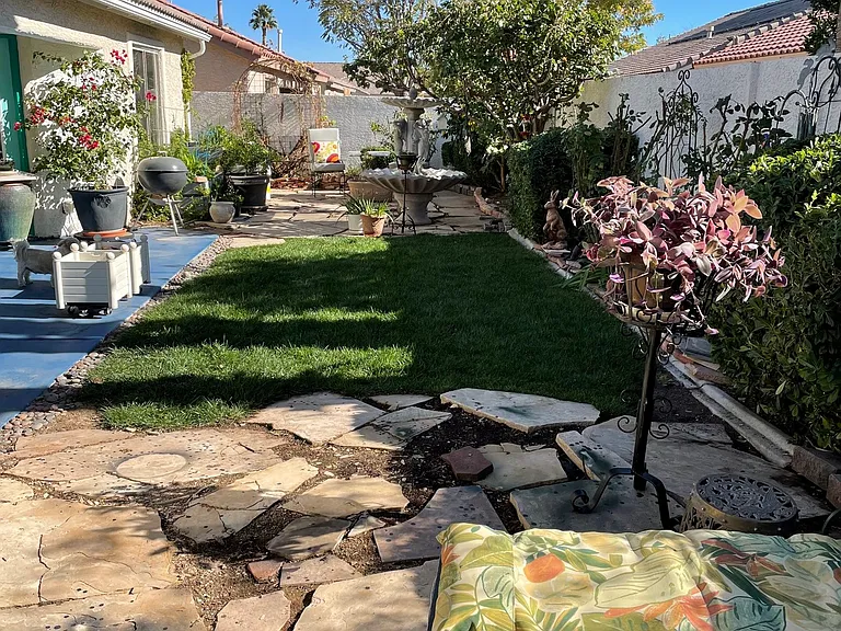 sitting area in backyard, flagstone and real grass, very private from all neighbors