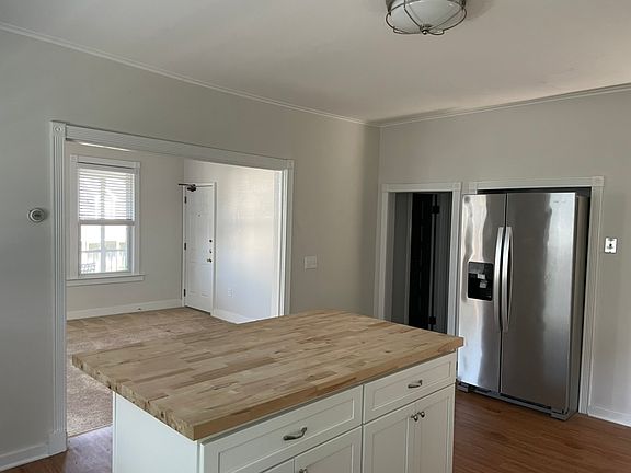 Kitchen with view into living room