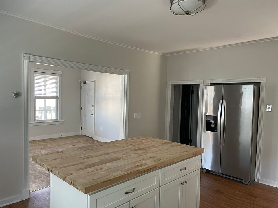 Kitchen with view into living room