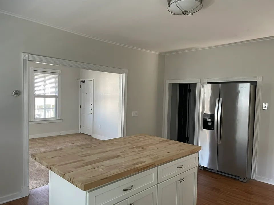 Kitchen with view into living room