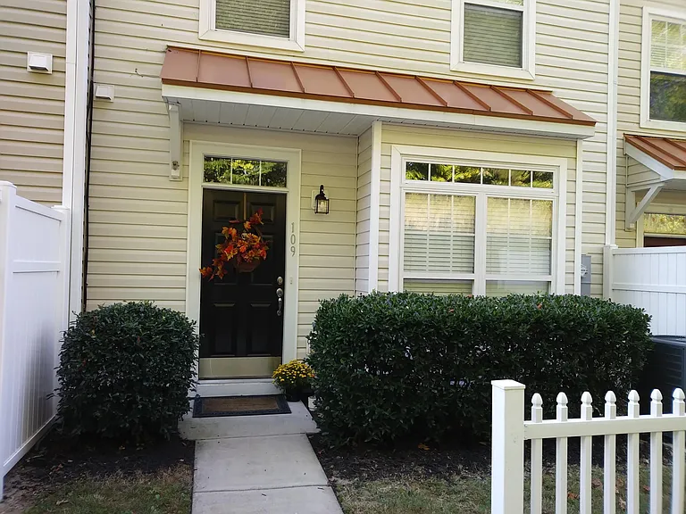 Private Entrance with manicured yard.