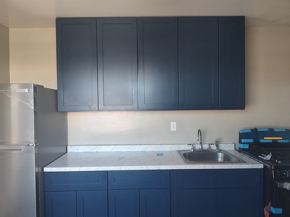 Updated Kitchen with brand new cabinets, sleek countertops, and stainless steel appliances.