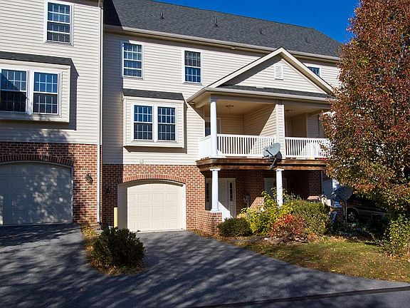 Back of house with garage