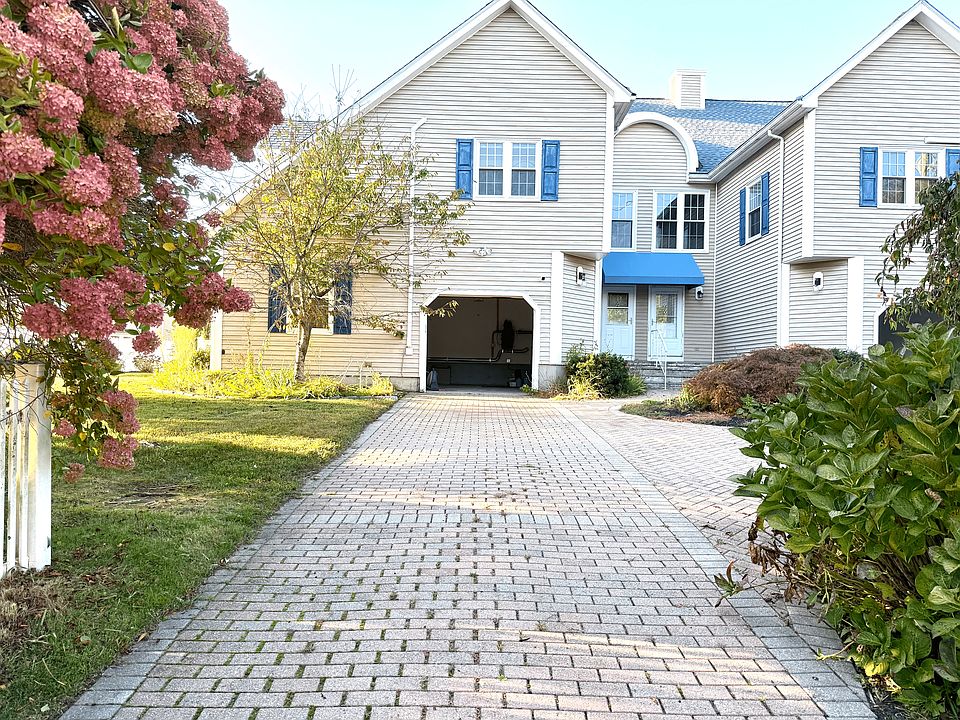 Front View. Driveway and garage
