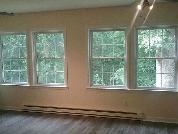 Back sun room. There is a wonderful stream at the bottom of the hill!