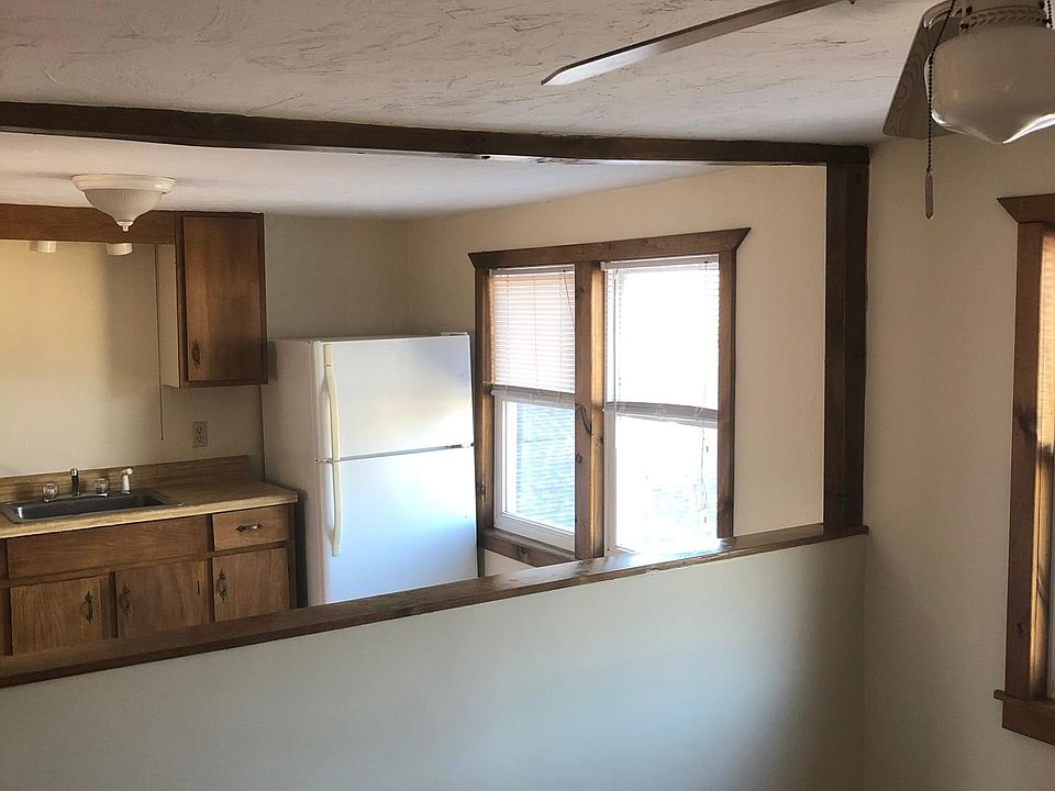 Half wall separates living room and kitchen