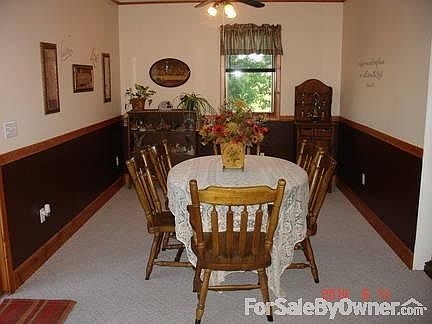 Dining room off the kitchen with patio door to the left facing south.