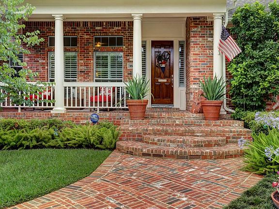 I love these wide brick steps leading to the entry. And a wide front porch that you can actually sit