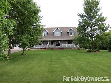 View from 42nd St
						:
						Many mature trees and paved driveway.