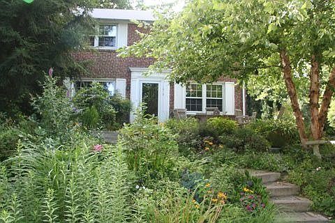 professionally landscaped front yard