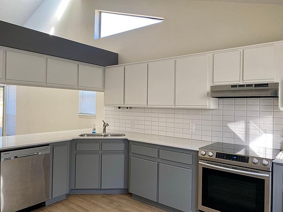 Large, stylish eat-in kitchen, open pass through to living room.