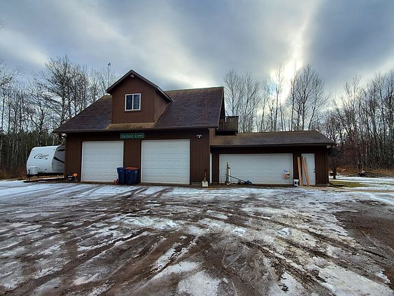 Garage with “Man Cave” above