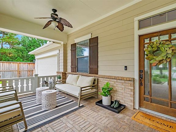 Look at how inviting this space is! This wonderful covered porch lends to evenings relaxing with neighbors sharing a cool beverage!