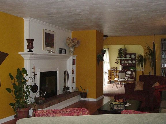 Fireplace with refinished face and newer mantle