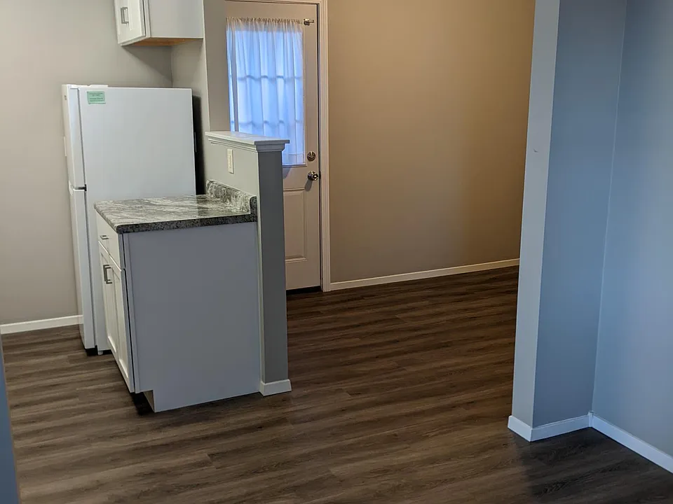 View from living area into dining area and back patio door