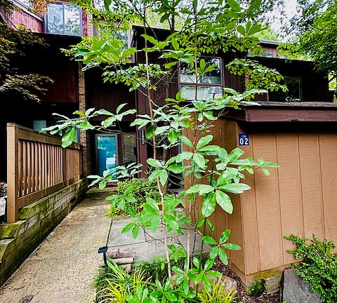 Step through the charming front entrance, where you're welcomed by a private azalea garden in full bloom, creating a vibrant and serene first impression. This peaceful outdoor space offers both privacy and natural beauty, with seasonal color.