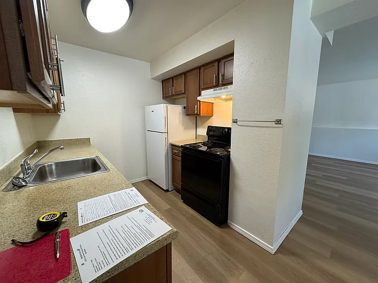 Kitchen with electric stove, fridge & dishwasher