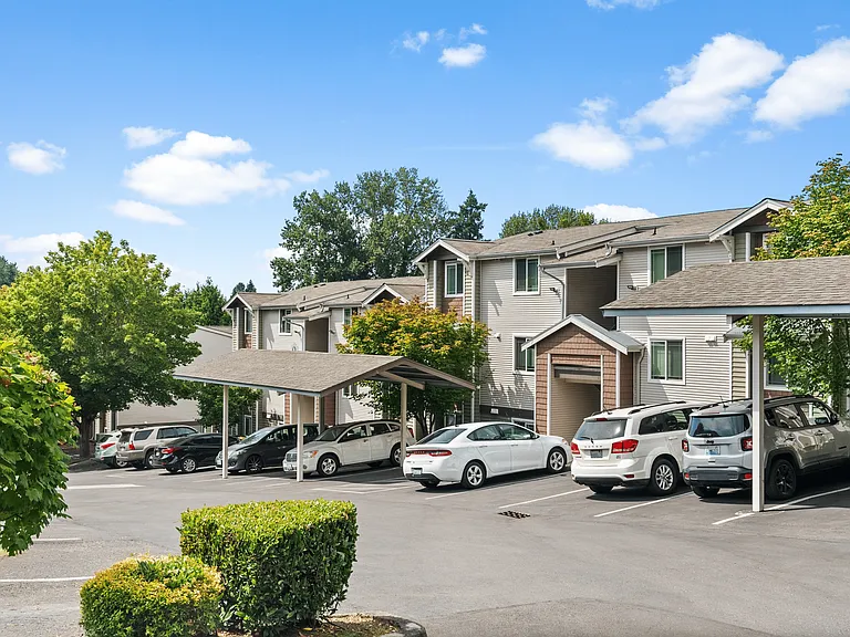 Covered parking and well-maintained landscaping create a welcoming entrance to our community.