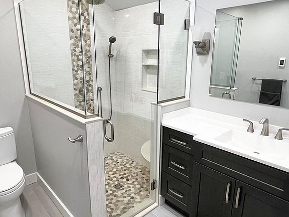 Newly renovated spa-like bathroom with large walk-in shower and heated flooring