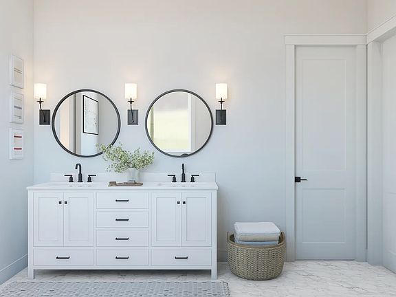 Primary bath featuring freestanding vanity with dual sinks