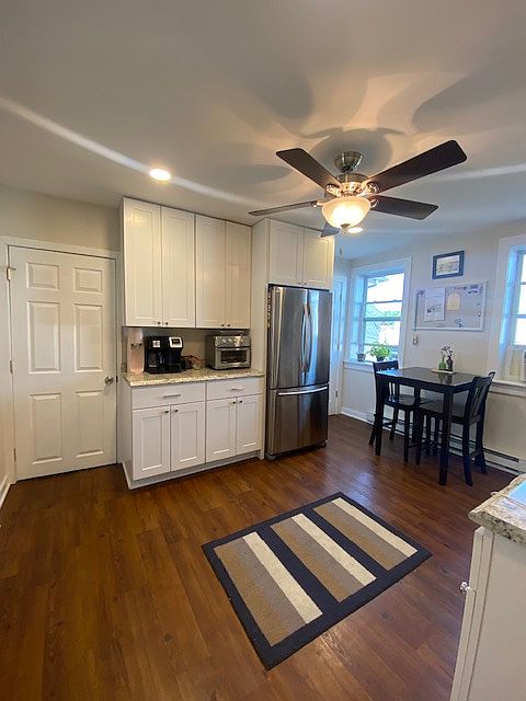 Large eat- in kitchen with new cabinetry and flooring