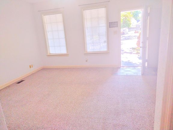 Living room looking out the front door.