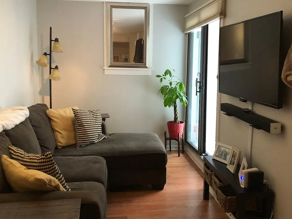 Living room with sliding door opens to outdoor patio