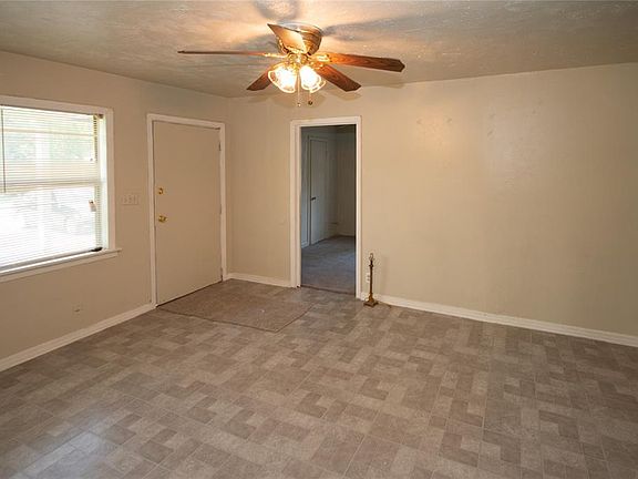 Another look at living room and door straight ahead is master bedroom