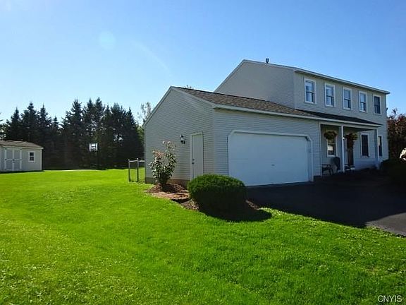 Large private back yard with a shed and a basketball court!! Large two car garage and driveway-plenty of space for parking!!