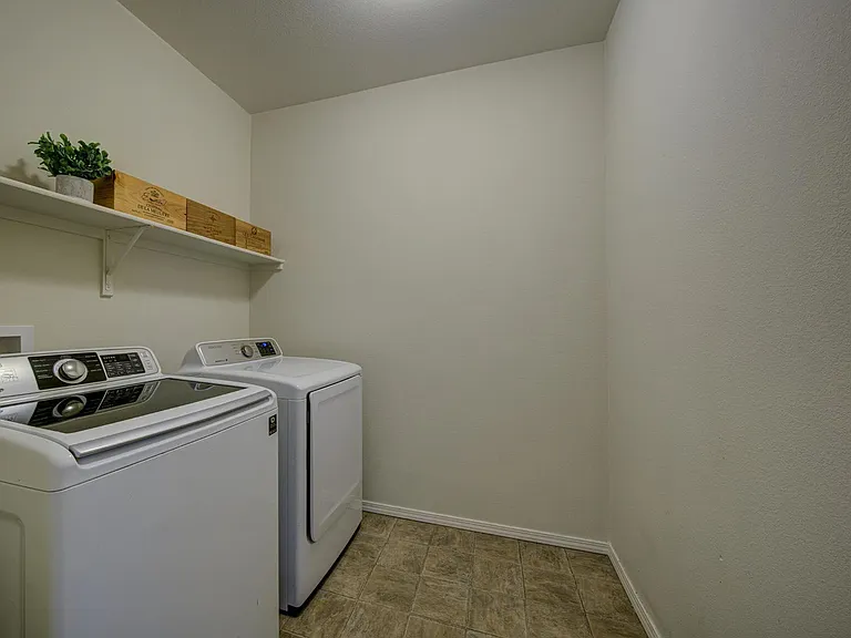 Spacious laundry room with Samsung washer and dryer.