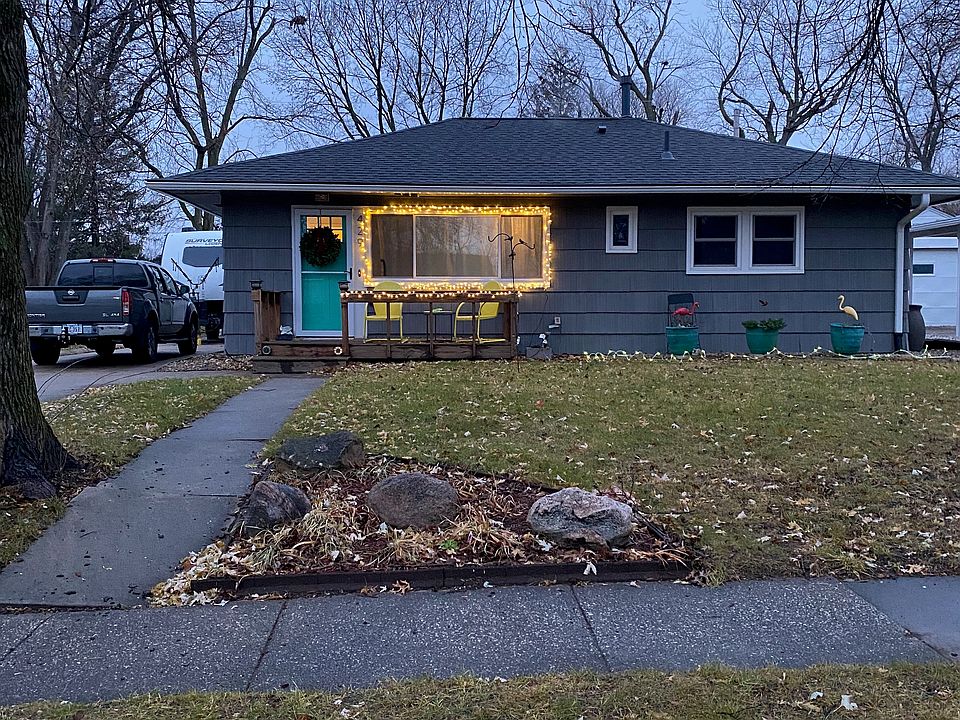 Exterior of house. Long single driveway to 2-car garage in rear.