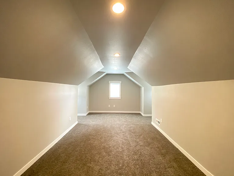 Large loft for extra bedroom or entertainment room. Three windows to add plenty of light!