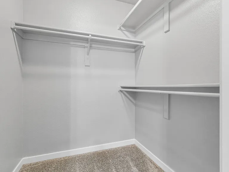 A spacious walk-in Closet at The Buttes Apartment Homes in Loveland, CO