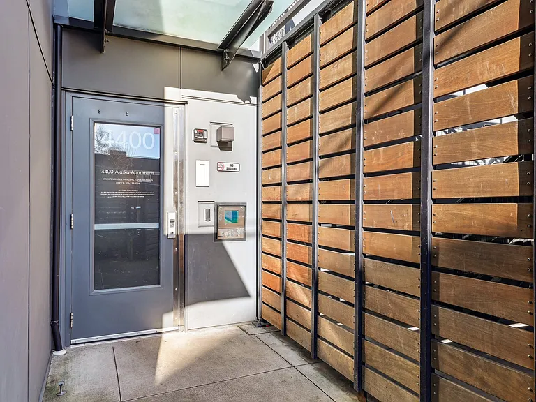 Discover the modern entrance of 4400 Alaska Apartments in Seattle, WA. Featuring secure access and contemporary design, offering convenient urban living in t...