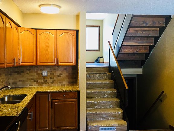 Stairs up to main level living room & down to family room an