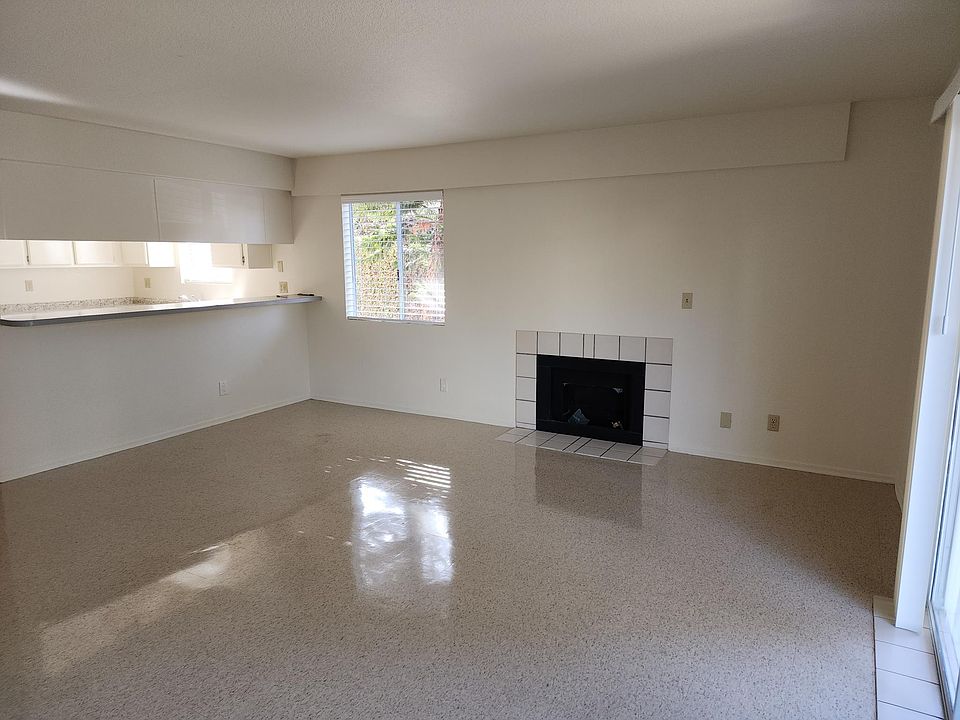 Living room with fireplace. Pass through to kitchen.