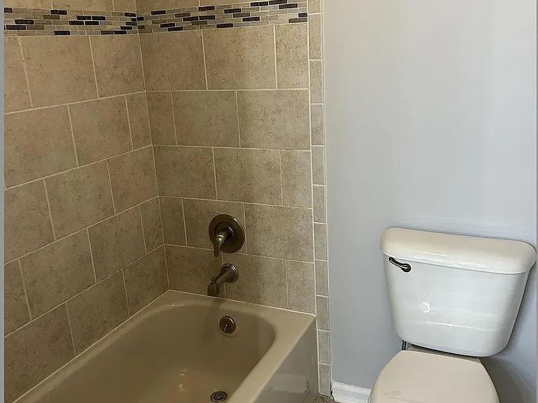 Shower/Tub with Toilet; closed off by Barn Door