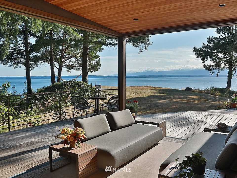 Your back is to the NanaWall (folding glass wall) and you are looking at one of the best features of this home; Retractable Phantom Screens that drop down from the West and South to create a screened-in porch.