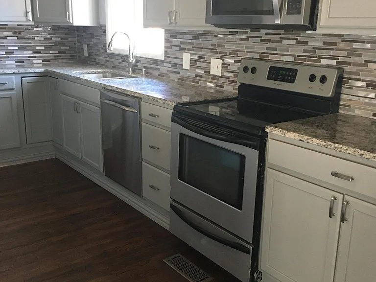 Kitchen was remodeled two years ago. Granite countertops, plenty of cabinet space and large inclosed space for washer and dryer.