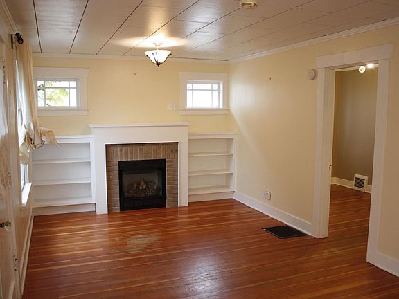Living Room with gas fireplace and built in cabinets