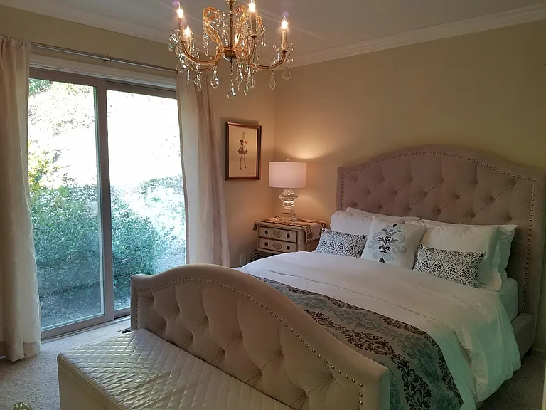 Unwind under the stars in a charming courtyard retreat, complete with a plush queen-size bed for the perfect night's rest.