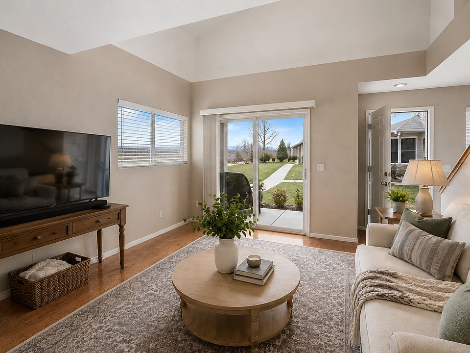 Living Room. Incredible view of mountains from the sliding glass door and patio.